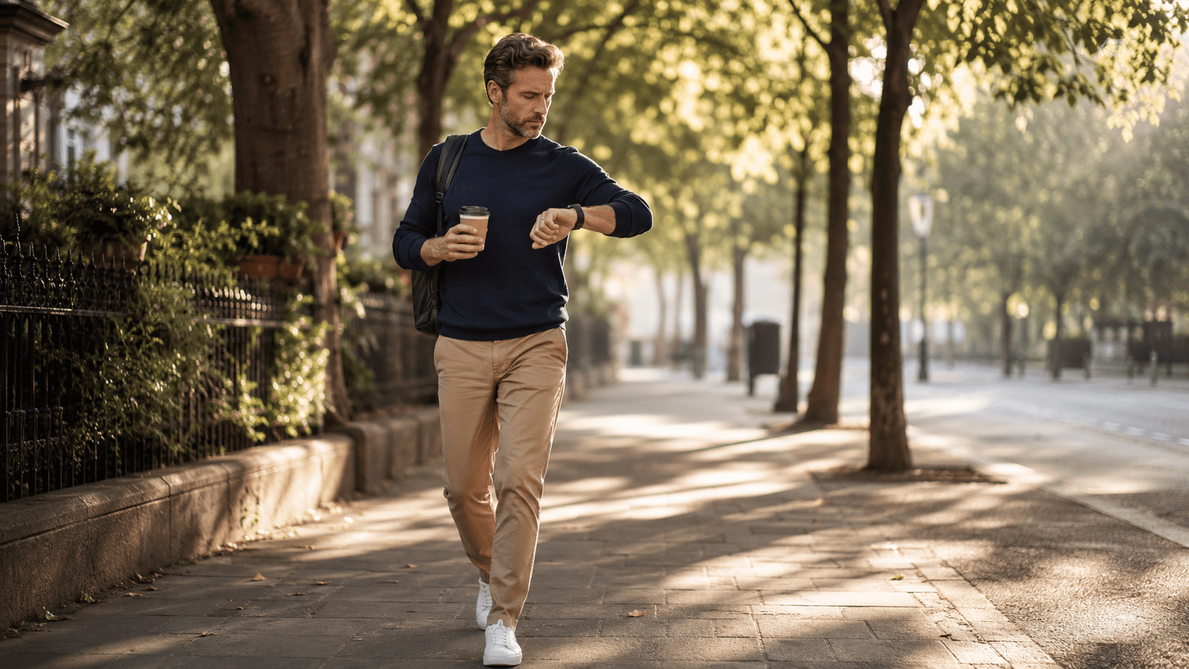 A person walking outdoors throughout the day, illustrating how daily steps drive more total energy expenditure than a single gym cardio session