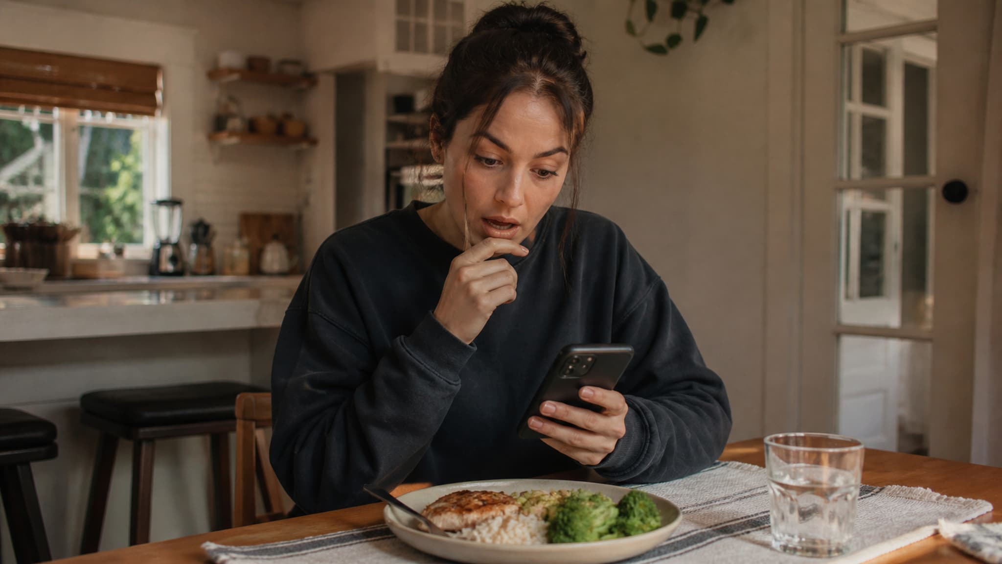 A person logging their food intake in a tracking app on their phone — the moment of realising their protein intake is far lower than expected